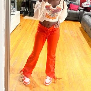 Orange laced-up sweatpants